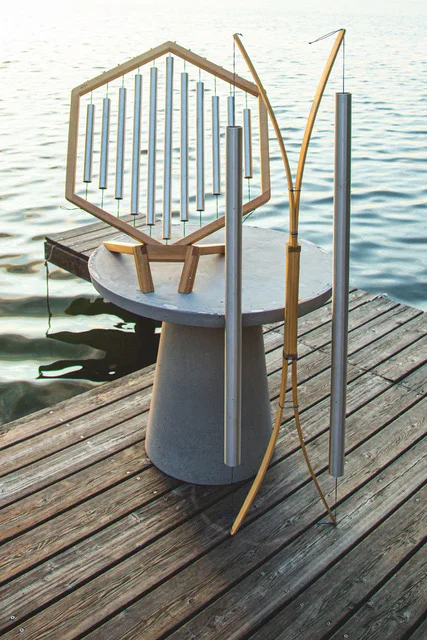 Kailani and Whalerider instruments on a wooden jetty by a lake