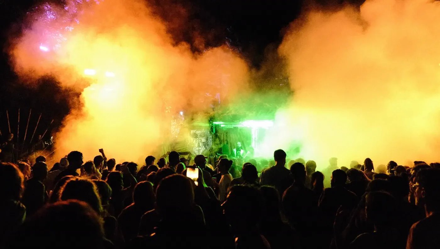 Crowd in front of a festival stage at night